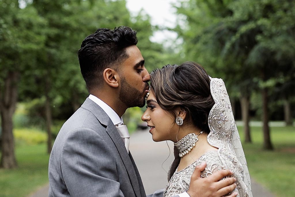 Frame from a wedding film of an Asian bride and groom